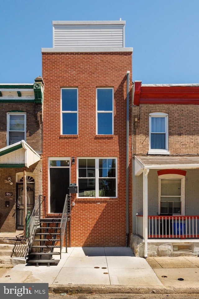 townhome / multi-family property featuring brick siding