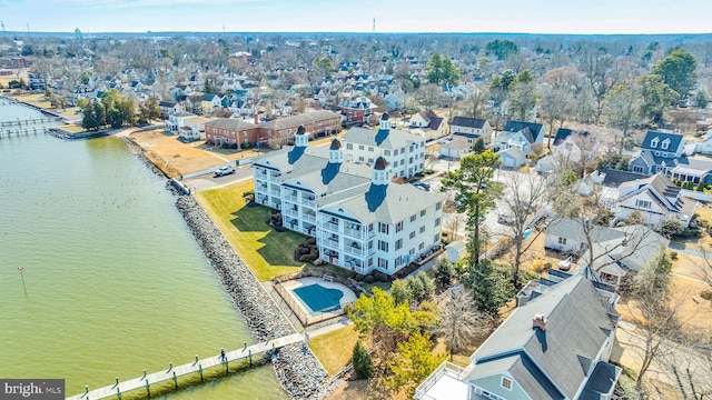 birds eye view of property featuring a water view and a residential view