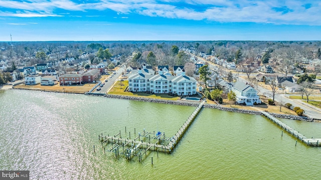 birds eye view of property featuring a water view and a residential view