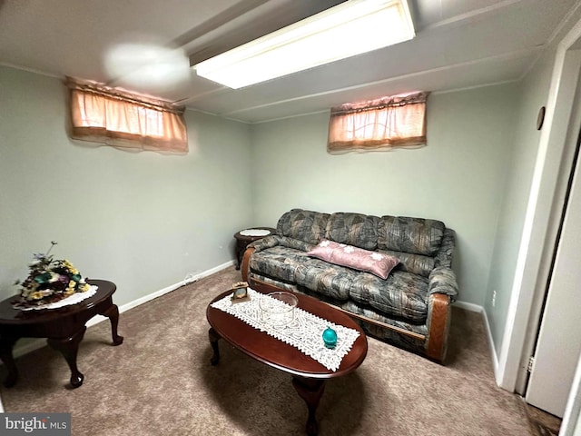 living room featuring plenty of natural light, baseboards, and carpet flooring