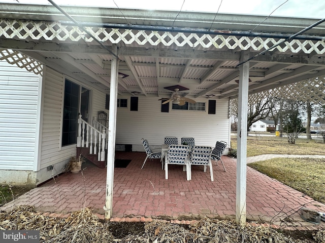 view of patio / terrace with entry steps, ceiling fan, and outdoor dining space