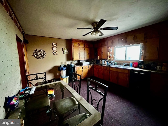 kitchen featuring ceiling fan, brown cabinetry, and a sink