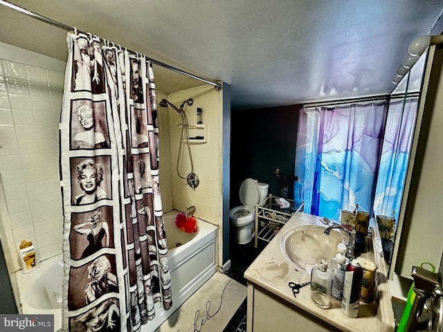 bathroom with toilet, shower / tub combo, and vanity