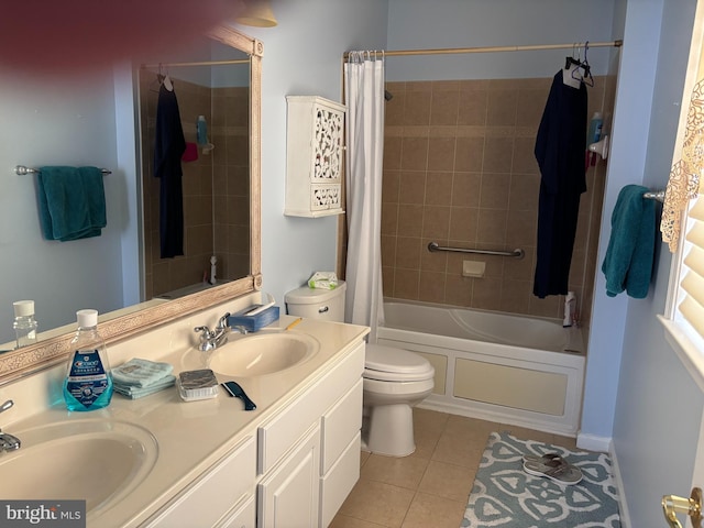 bathroom featuring tile patterned floors, double vanity, shower / tub combo, and a sink