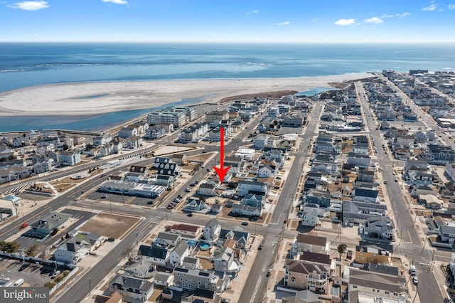 aerial view featuring a water view and a view of the beach