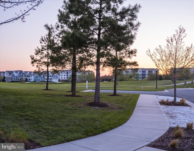 view of property's community with a yard and a residential view