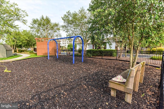 communal playground featuring fence