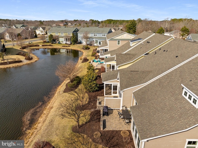 aerial view with a water view and a residential view