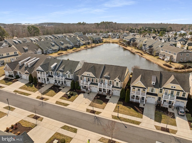 aerial view featuring a water view and a residential view