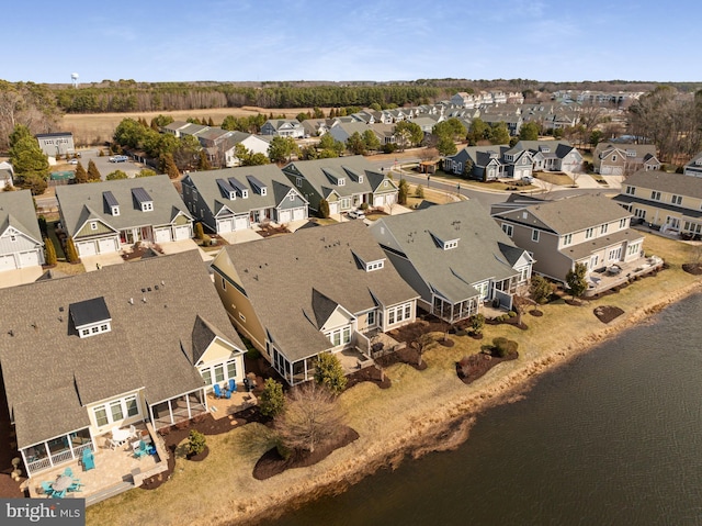 birds eye view of property with a residential view