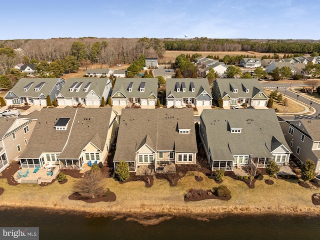 aerial view featuring a water view and a residential view