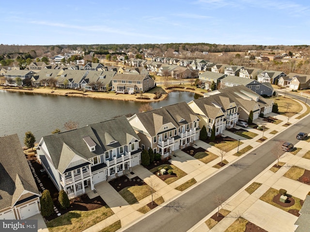 bird's eye view with a water view and a residential view