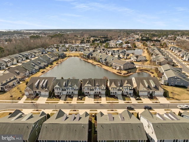 drone / aerial view with a residential view and a water view