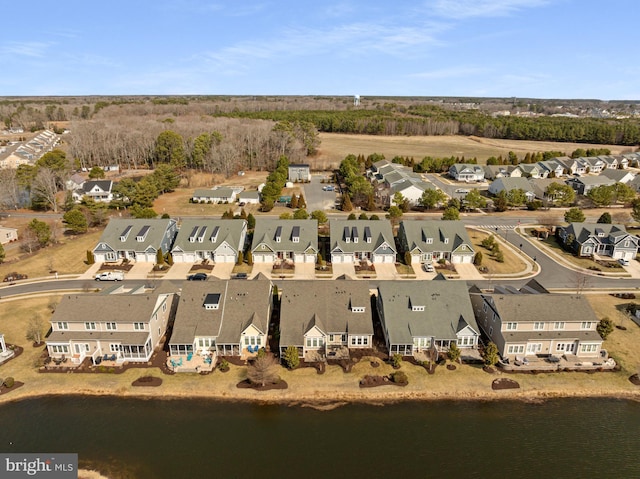 bird's eye view featuring a residential view and a water view