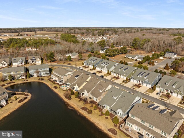 birds eye view of property featuring a water view and a residential view