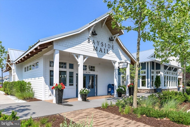 view of front facade featuring metal roof and french doors