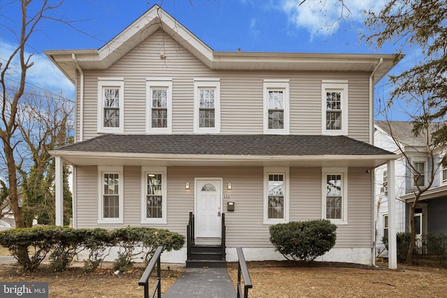 view of front of home featuring entry steps and a shingled roof