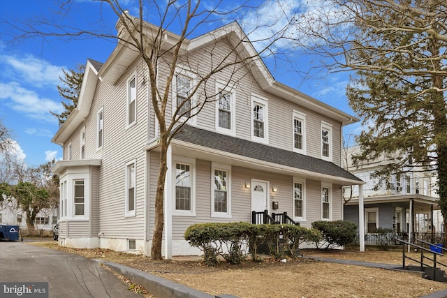 view of front of home with roof with shingles