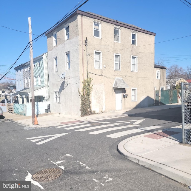 exterior space featuring curbs and sidewalks