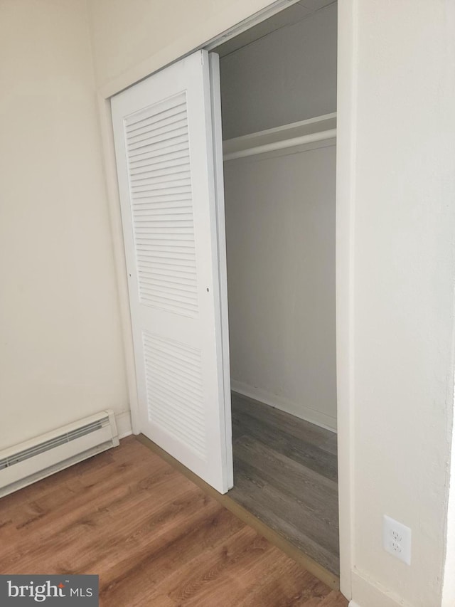 closet with a baseboard radiator