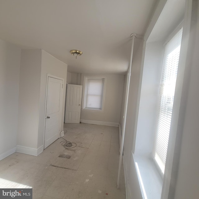 interior space featuring baseboards