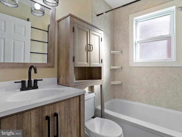 bathroom with toilet, shower / bathtub combination, and vanity