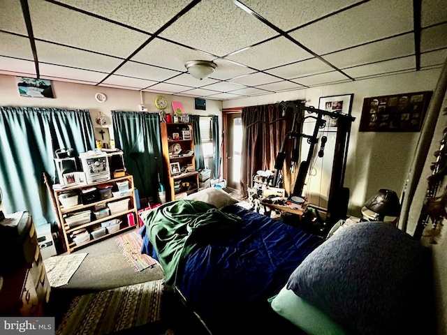 bedroom featuring a paneled ceiling