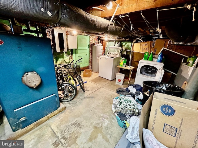 unfinished basement featuring washer / dryer and water heater