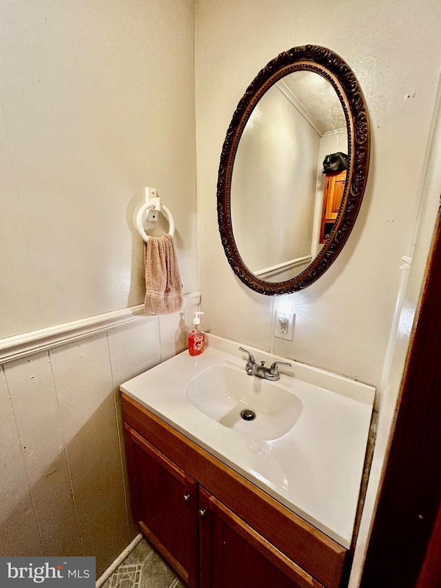 bathroom with vanity and wainscoting