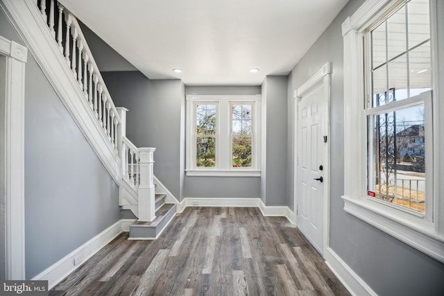 entryway with recessed lighting, dark wood-style flooring, baseboards, and stairs