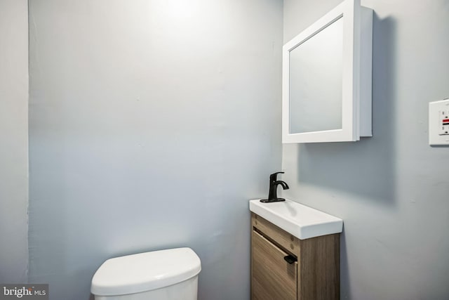 half bath with toilet and vanity