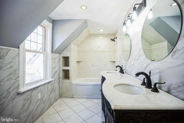 bathroom with a sink, tile walls, and recessed lighting