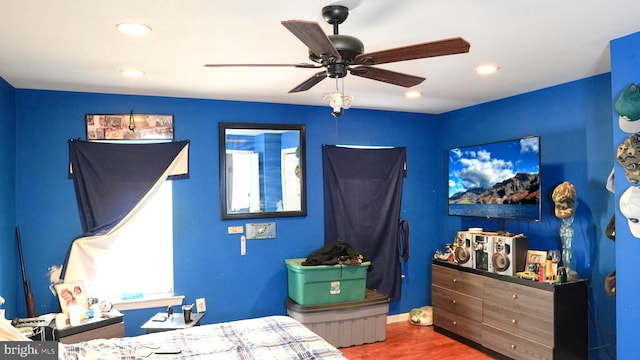 bedroom with ceiling fan, wood finished floors, and recessed lighting