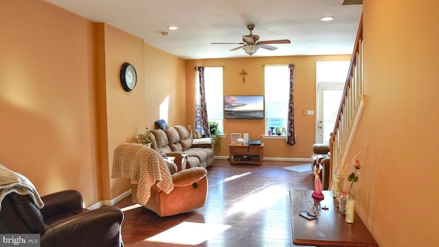 living room featuring baseboards, a ceiling fan, dark wood-style floors, stairs, and recessed lighting