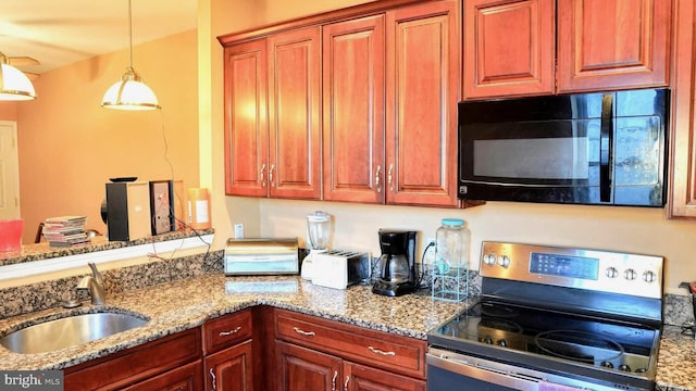 kitchen with black microwave, a sink, stainless steel electric range, and light stone countertops