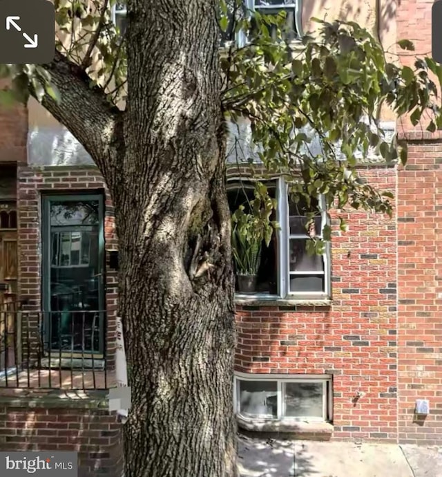 view of side of property with brick siding