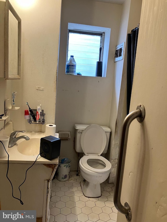 full bathroom featuring toilet and vanity