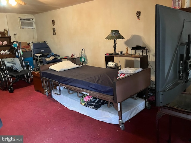 carpeted bedroom featuring a wall unit AC