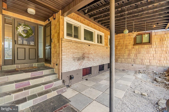 property entrance with brick siding