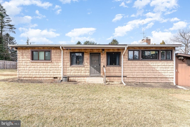 ranch-style home with crawl space, a front lawn, a chimney, and fence