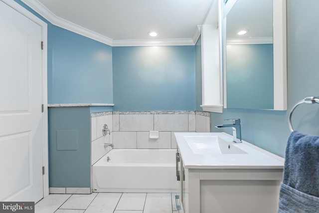 bathroom with marble finish floor, a garden tub, recessed lighting, ornamental molding, and vanity