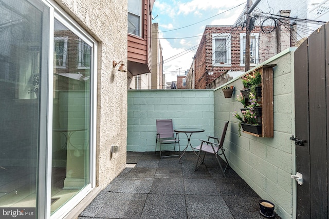 view of patio / terrace featuring fence