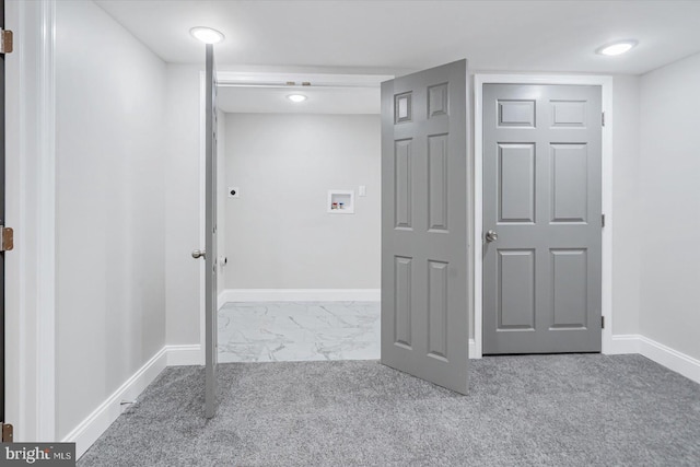 corridor with marble finish floor, baseboards, and carpet flooring