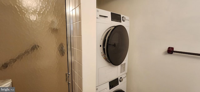 laundry room with laundry area and stacked washer and clothes dryer