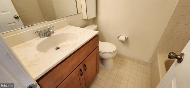 bathroom featuring toilet, vanity, and tile patterned floors