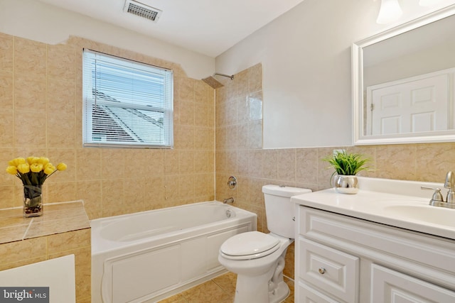 full bathroom with visible vents, tile patterned floors, tub / shower combination, vanity, and tile walls