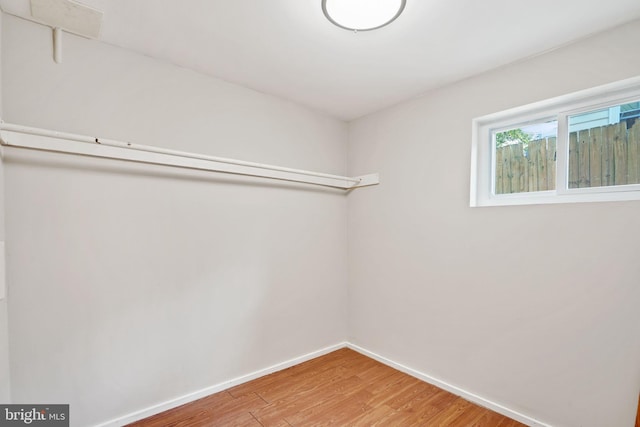 spacious closet featuring wood finished floors