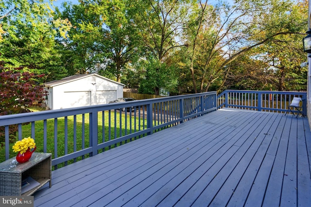 wooden deck featuring fence, a lawn, and an outdoor structure