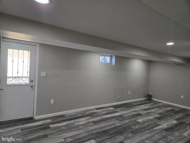 basement with dark wood-style floors, recessed lighting, and baseboards