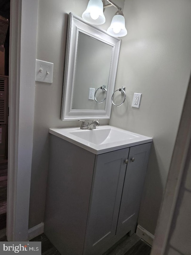 bathroom with baseboards and vanity